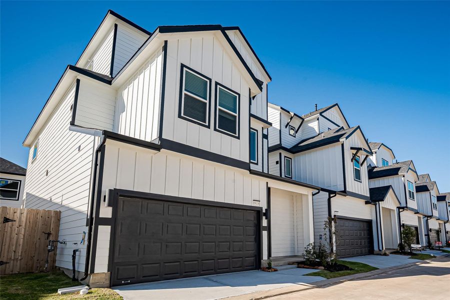 Front exterior of a new home in Regents Court, Houston, TX, highlighting curb appeal (Image 19).