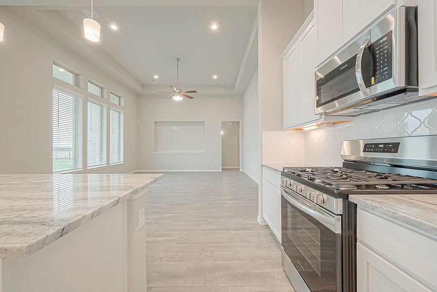 Representative furnished interior of a home built from the Floor Plan 2050 by Colina Homes in Grand Magnolia, Magnolia (Image 16).