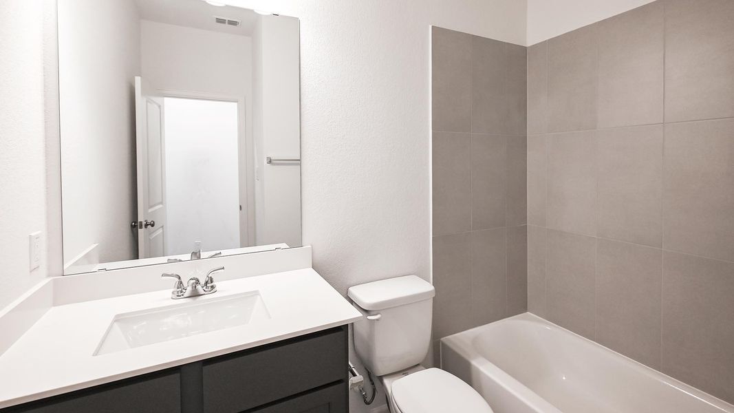 Furnished interior view inside a new home in Crosswinds 40', Kyle (Image 12).