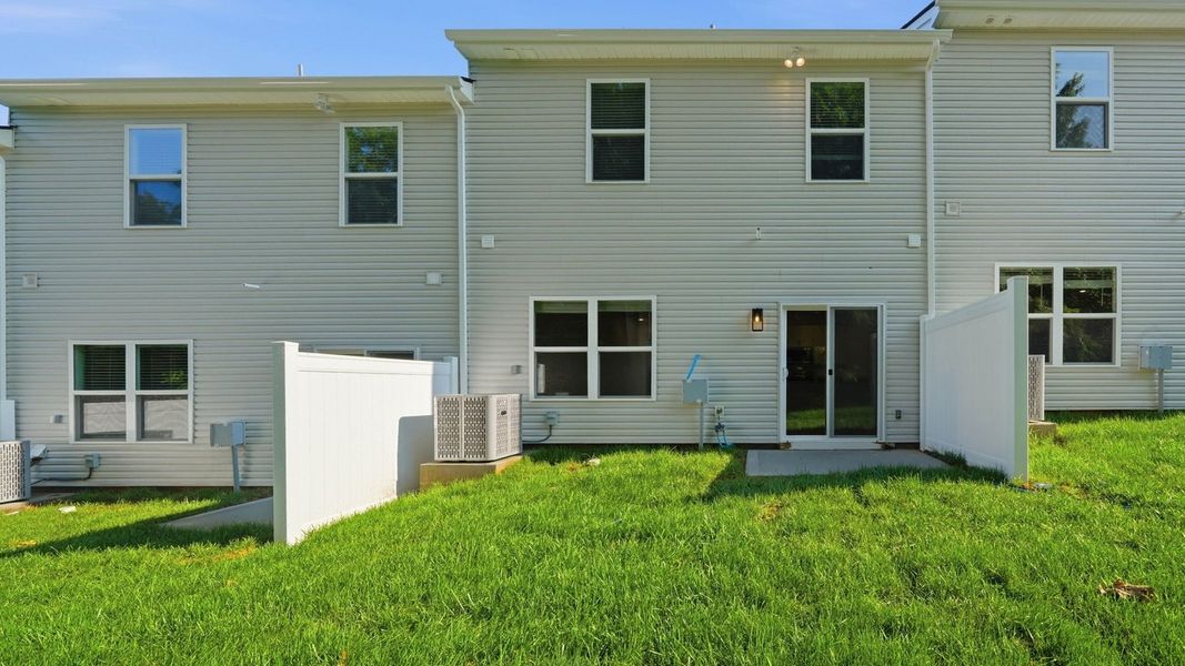Exterior details and patio area of a home in Macon Townhomes, Seymour (Image 3). Exterior details and patio area of a home in Macon Townhomes, Seymour (Image 3).