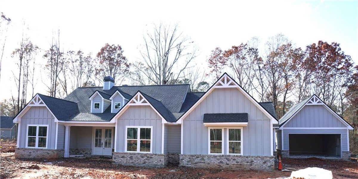 Front exterior of a new home in , Monroe, GA, highlighting curb appeal (Image 1).