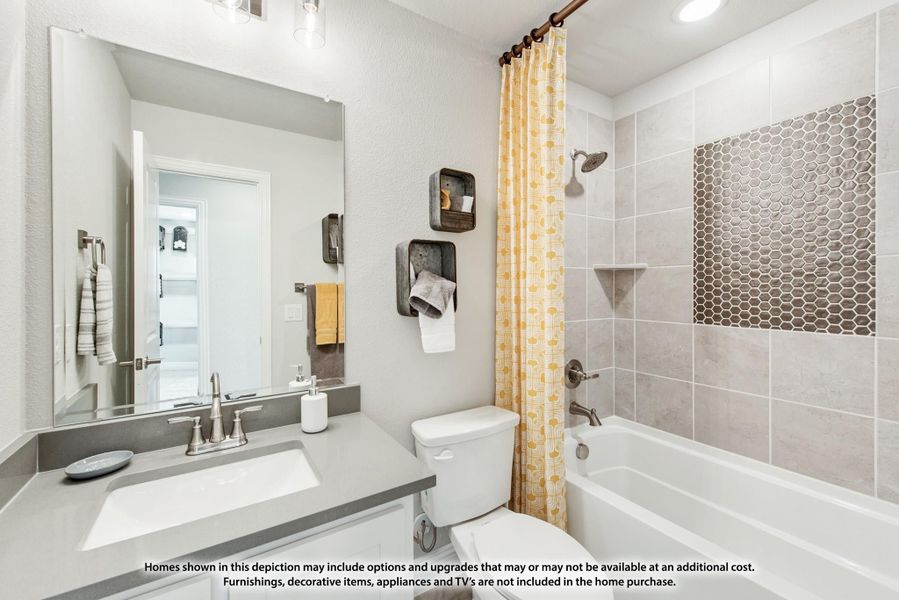Bathroom with gray countertop vanity, tub-shower combo with tile surround, and yellow shower curtain Bathroom with gray countertop vanity, tub-shower combo with tile surround, and yellow shower curtain