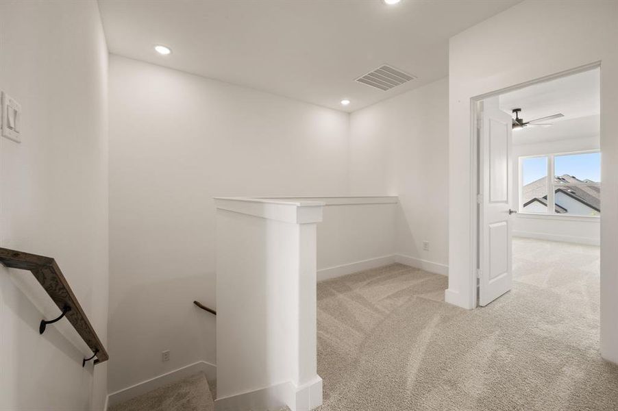 The loft at the top of the stairs makes a perfect pocket office or reading nook.