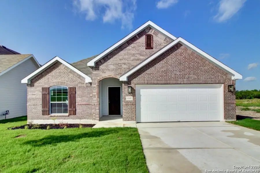Front exterior of a new home in Prairie Green, Converse, TX, highlighting curb appeal (Image 1).