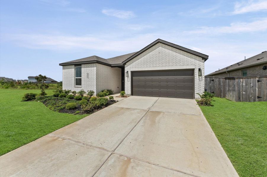 Front exterior of a new home in The Grand Prairie, Hockley, TX, highlighting curb appeal (Image 21).