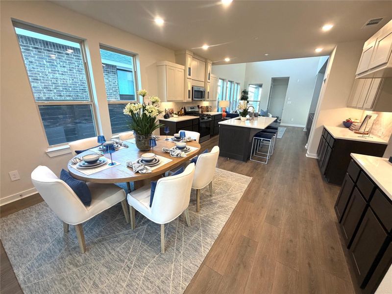 This stunning kitchen features beautiful cabinetry and fixtures, and abundant counter space for both everyday living and entertaining.