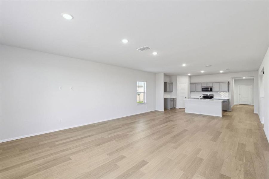 Open First Floor in the Holden home plan by Trophy Signature Homes – REPRESENTATIVE PHOTO