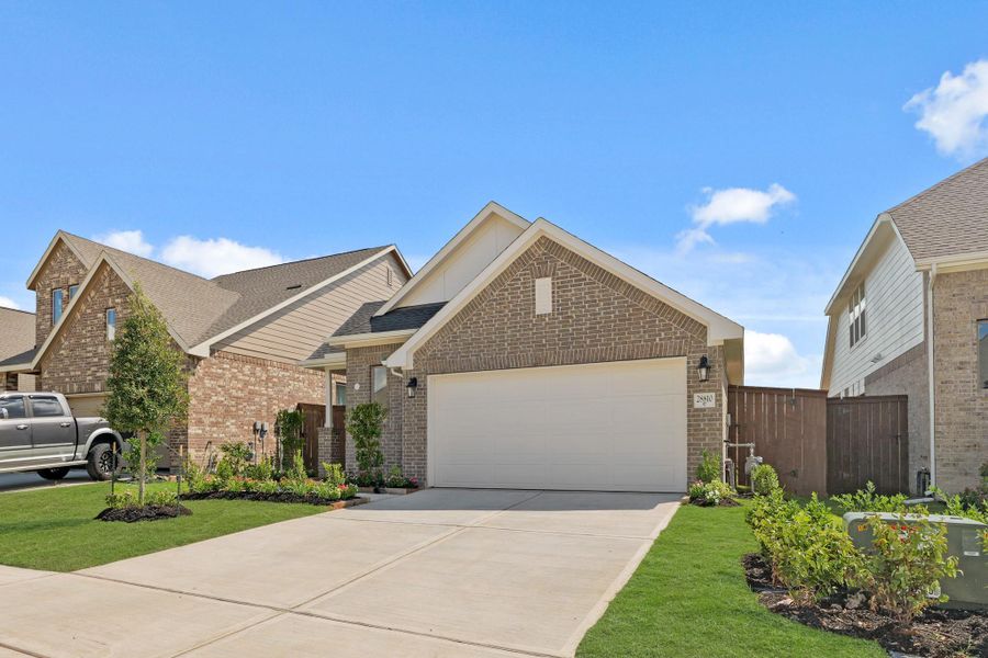 Front exterior of a new home in The Trails, New Caney, TX, highlighting curb appeal (Image 22). Front exterior of a new home in The Trails, New Caney, TX, highlighting curb appeal (Image 22).