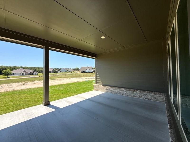 Exterior details and patio area of a home in Oak Grove Addition, Springtown (Image 20).