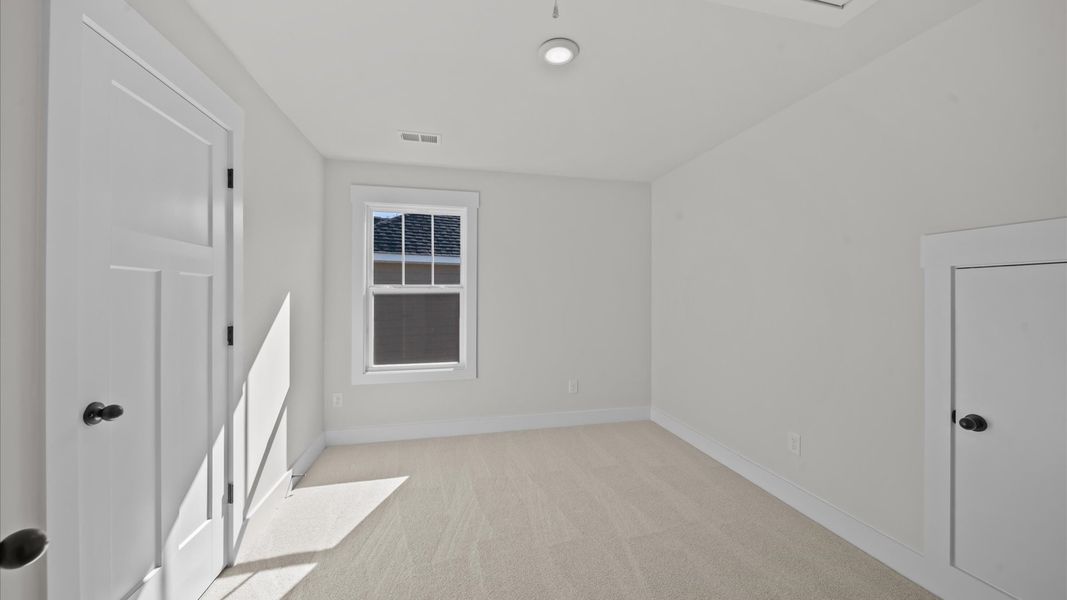 First-class secondary bedroom with comfortable carpeted flooring and generous closet space First-class secondary bedroom with comfortable carpeted flooring and generous closet space