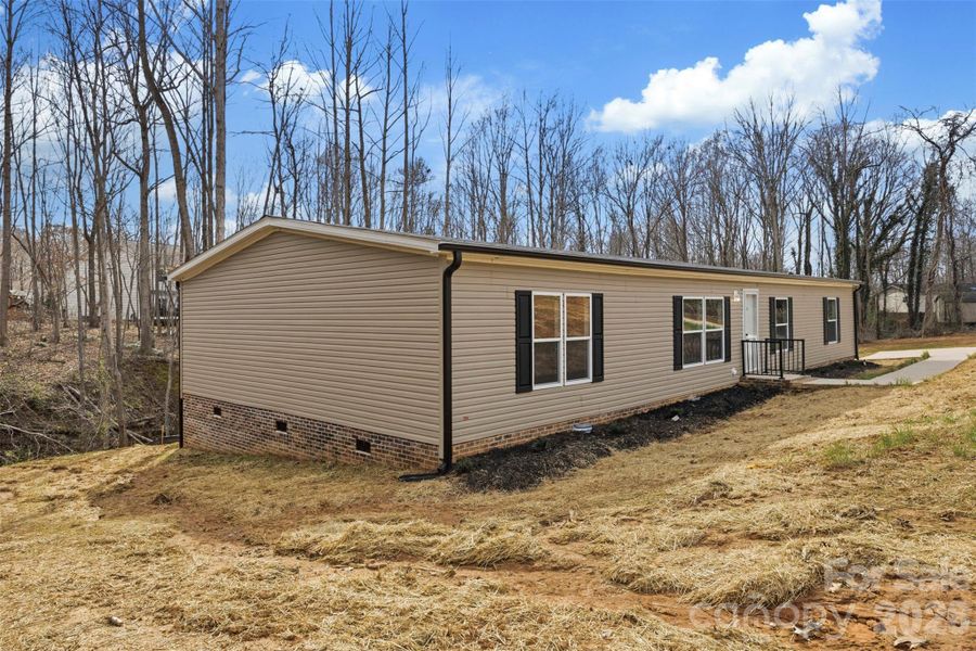 Exterior details and patio area of a home in , Mooresville (Image 17).