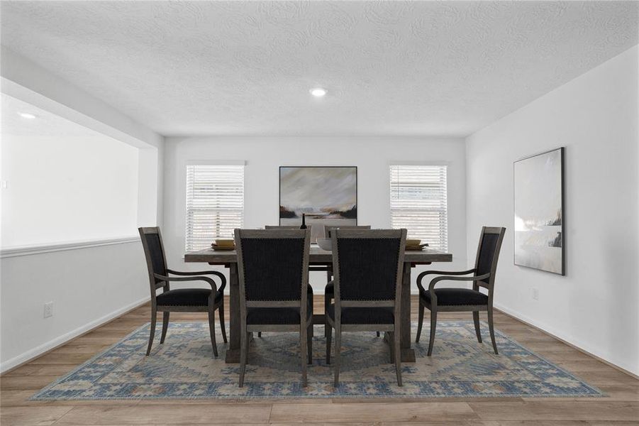 Make memories gathered around the table with your family and friends! This Flex Space is used here as a dining room and features high ceilings, large windows, and easy access to your kitchen and living room.