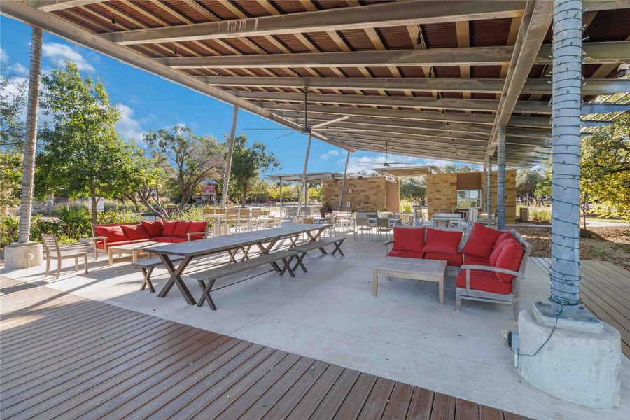 Wooden deck featuring an outdoor living space, outdoor dining space, and a patio Wooden deck featuring an outdoor living space, outdoor dining space, and a patio