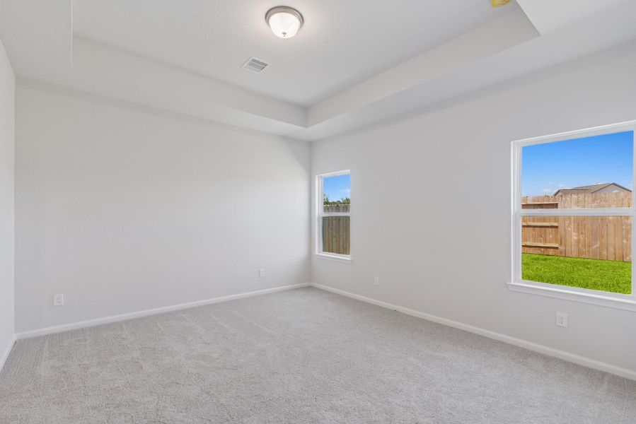 The Blue Jay II- Primary Bedroom Suite with Tray Ceiling. Home under construction. Sample floor plan photo used for illustrative purposes only. Upgrades, selections options, and colors will vary. The Blue Jay II- Primary Bedroom Suite with Tray Ceiling. Home under construction. Sample floor plan photo used for illustrative purposes only. Upgrades, selections options, and colors will vary.