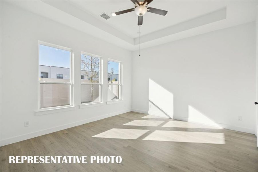 Peaceful and relaxing, your new owner's suite is located at the rear of the home for additional privacy.  REPRESENTATIVE PHOTO