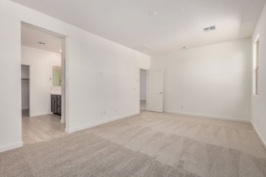 Spacious, unfurnished interior of a new home in The Villages at North Copper Canyon, Surprise (Image 9).