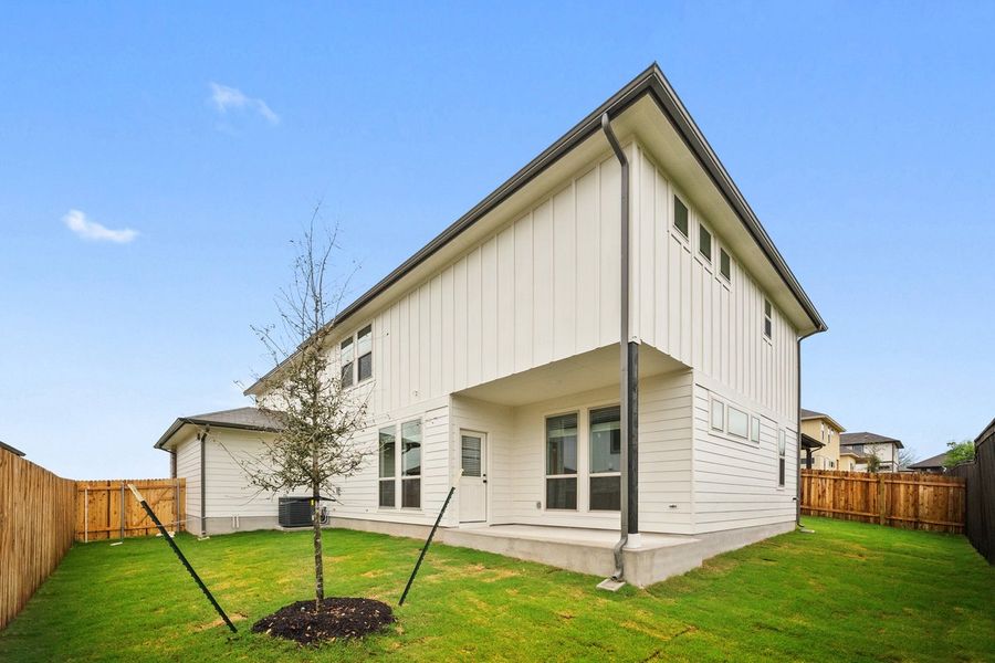 Front exterior of a new home in The Hills of Bear Creek, Manchaca, TX, highlighting curb appeal (Image 24).