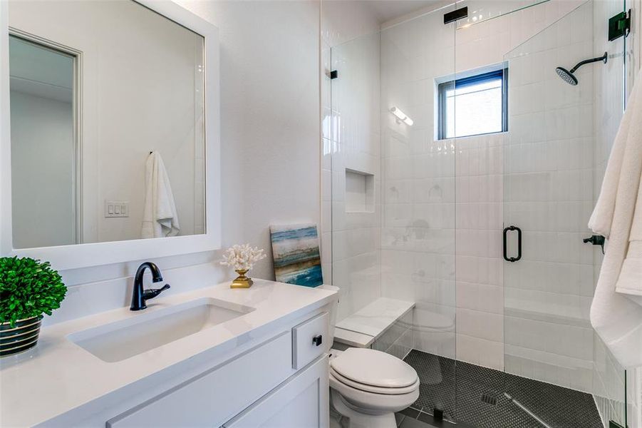 Full bath with vanity and a stall shower