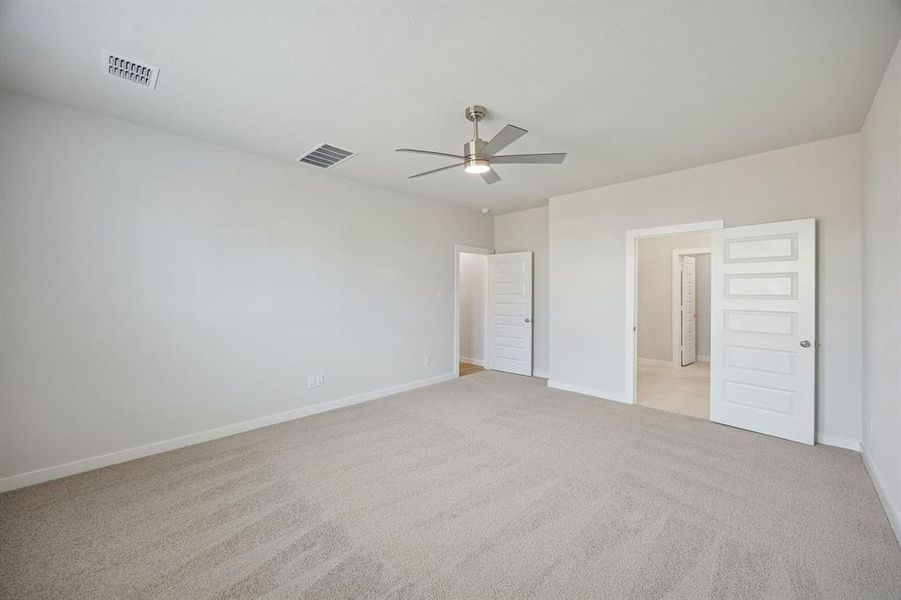 Primary Suite in the Masters home plan by Trophy Signature Homes – REPRESENTATIVE PHOTO