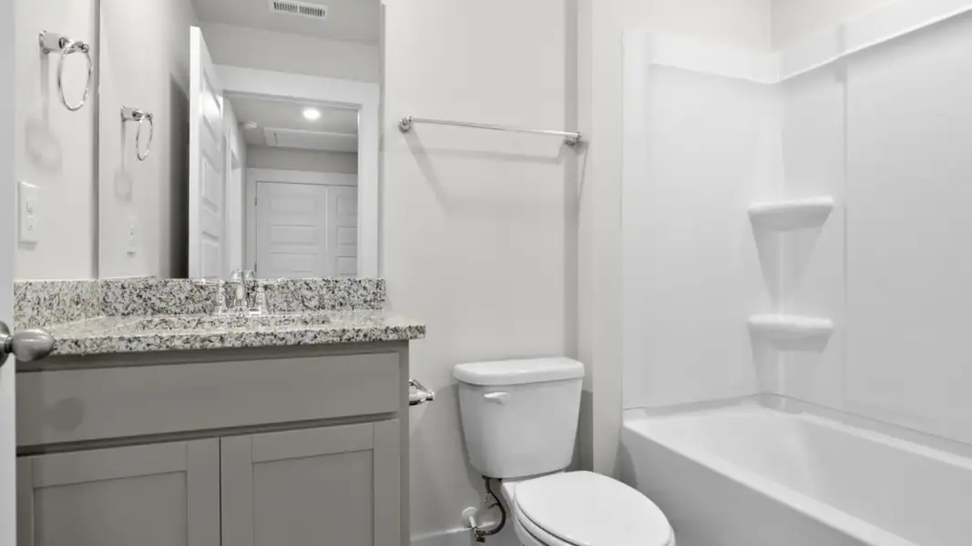 Furnished interior view inside a new home in The Townes at Cedar Hill Landing, Navassa (Image 10).