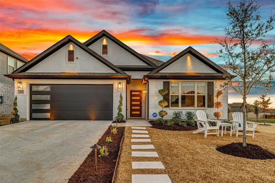 Front exterior of a new home in Woodstone, Providence Village, TX, highlighting curb appeal (Image 1). Front exterior of a new home in Woodstone, Providence Village, TX, highlighting curb appeal (Image 1).