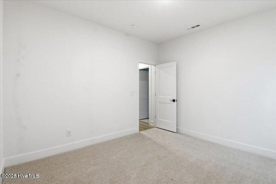 Spacious, unfurnished interior of a new home in Wood Creek Landing, Leland (Image 28).