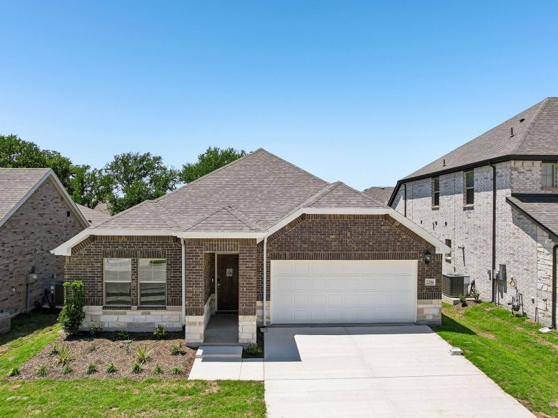 Front exterior of a new home in Stella Hills, Denton, TX, highlighting curb appeal (Image 21). Front exterior of a new home in Stella Hills, Denton, TX, highlighting curb appeal (Image 21).