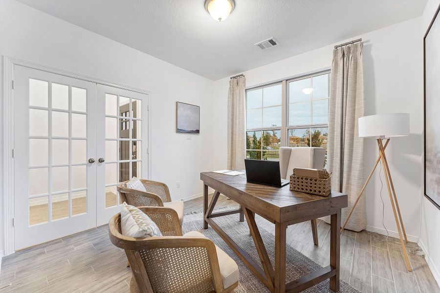 A room with a table and chairs. A room with a table and chairs.