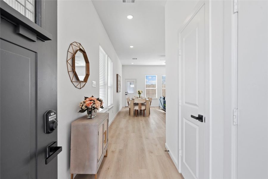 Step inside through a smart lock entry — added security and convenience before opening into the bright living area. Step inside through a smart lock entry — added security and convenience before opening into the bright living area.