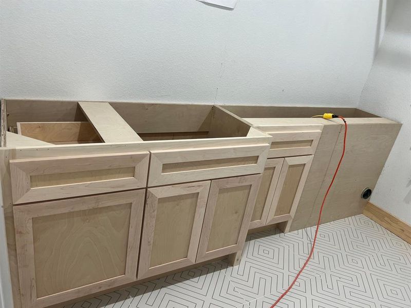 Laundry Room cabinetry, hookups are to the right