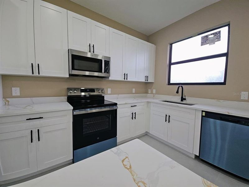 Furnished interior view inside a new home in , Port Charlotte (Image 9).