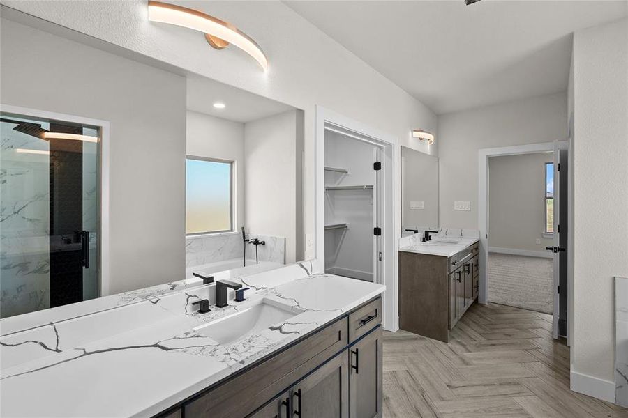 Bathroom with vanity, parquet flooring, and an enclosed shower