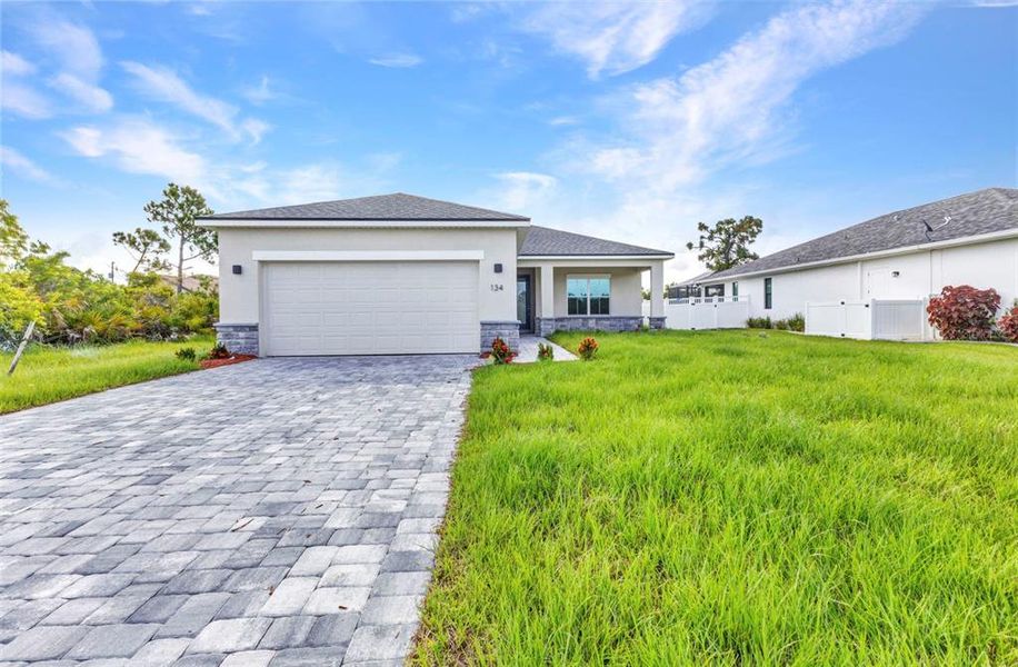 Front exterior of a new home in , Rotonda West, FL, highlighting curb appeal (Image 22). Front exterior of a new home in , Rotonda West, FL, highlighting curb appeal (Image 22).