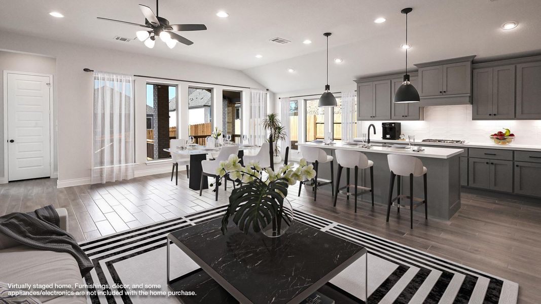 Living room featuring visible vents, wood finished floors, ceiling fan, and recessed lighting Living room featuring visible vents, wood finished floors, ceiling fan, and recessed lighting