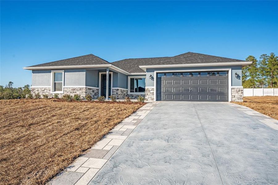 Front exterior of a new home in , Ocklawaha, FL, highlighting curb appeal (Image 19).