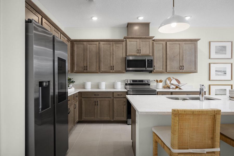 Representative furnished interior of a home built from the Dune by Risewell Homes in Watermark, Cocoa (Image 11).