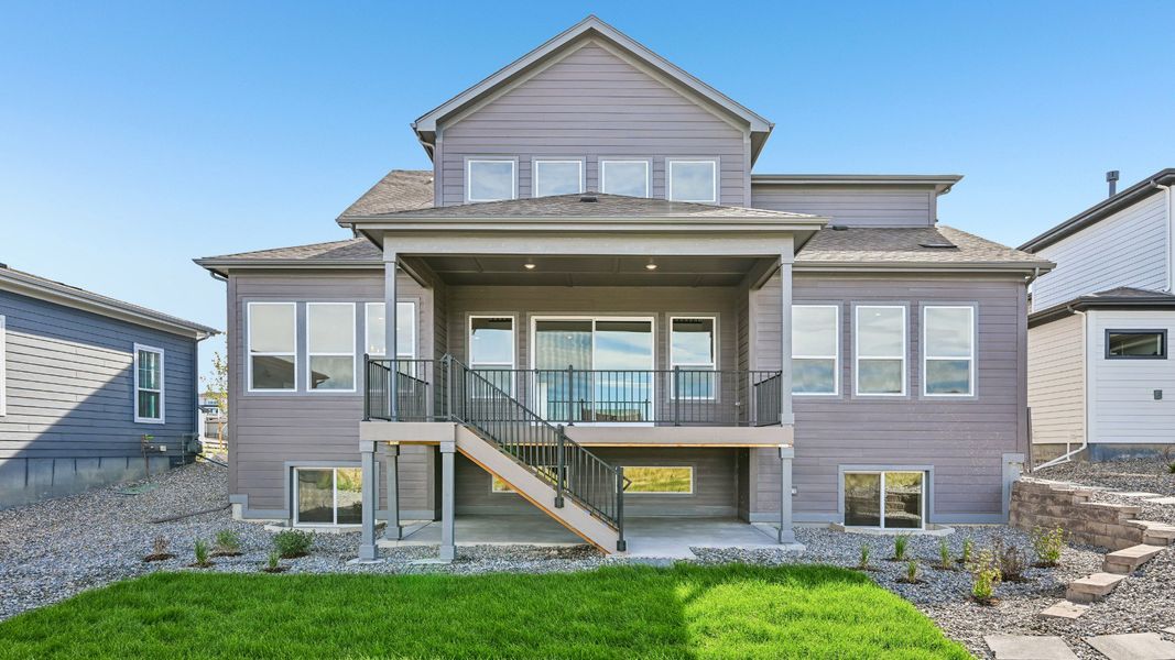 Rear exterior of the home showcasing outdoor living spaces and architectural details