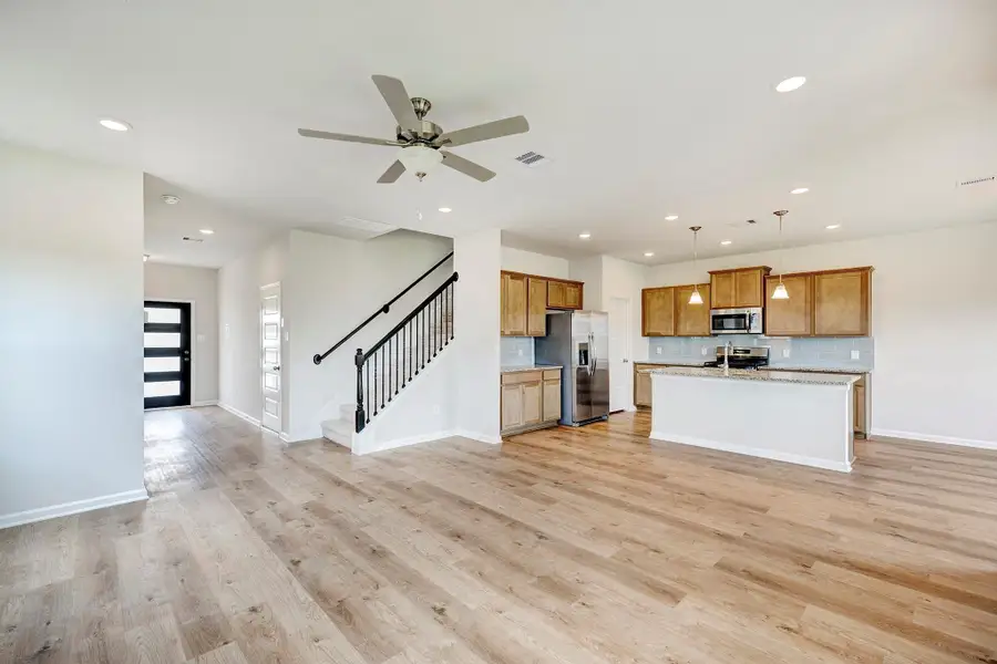 The Oriole II- Family Room into the Kitchen and Foyer. The Oriole II- Family Room into the Kitchen and Foyer.