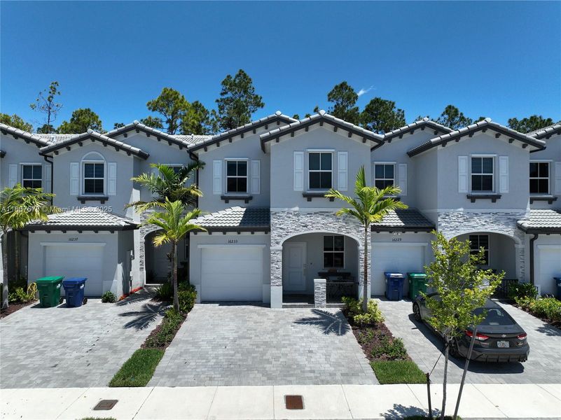 Front exterior of a new home in , Homestead, FL, highlighting curb appeal (Image 2).