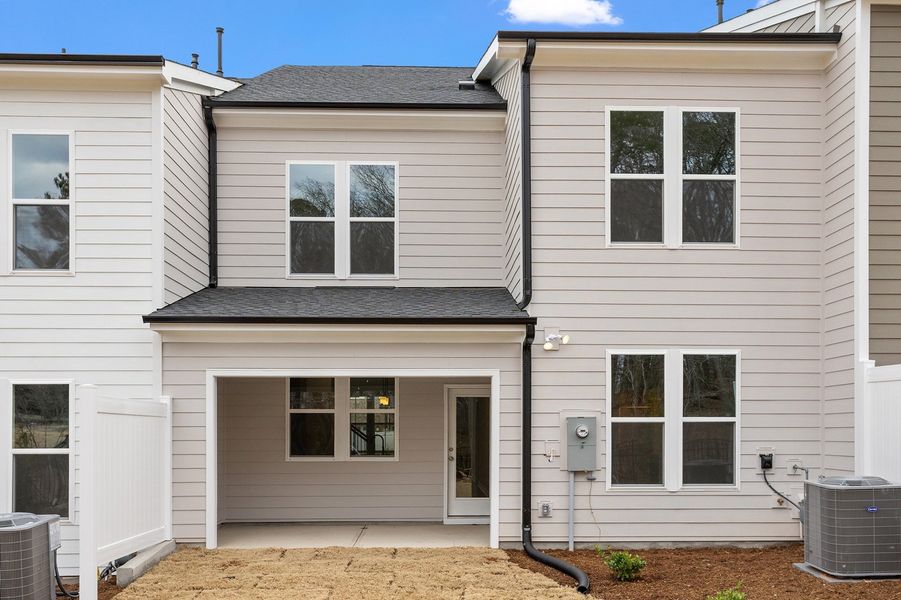 Exterior details and patio area of a home in Ovation at Sweetbrier, Durham (Image 4).