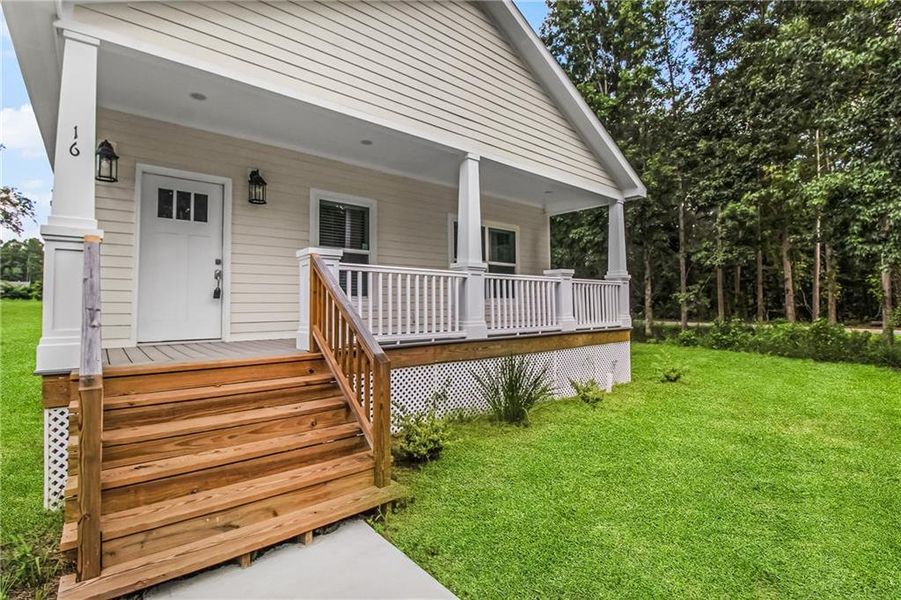Front exterior of a new home in , Ludowici, GA, highlighting curb appeal (Image 2). Front exterior of a new home in , Ludowici, GA, highlighting curb appeal (Image 2).