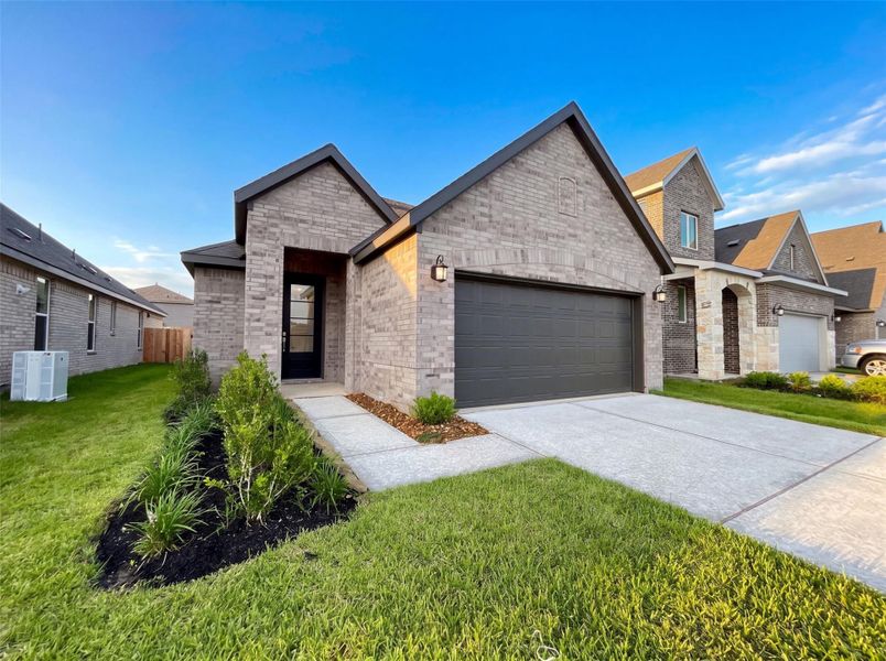 Front exterior of a new home in Binford Creek, Waller, TX, highlighting curb appeal (Image 1). Front exterior of a new home in Binford Creek, Waller, TX, highlighting curb appeal (Image 1).