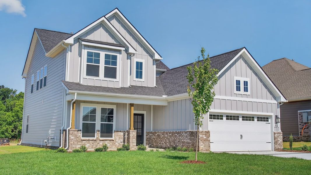Front exterior of a new home in McClure Farms, Columbia, TN, highlighting curb appeal (Image 2).