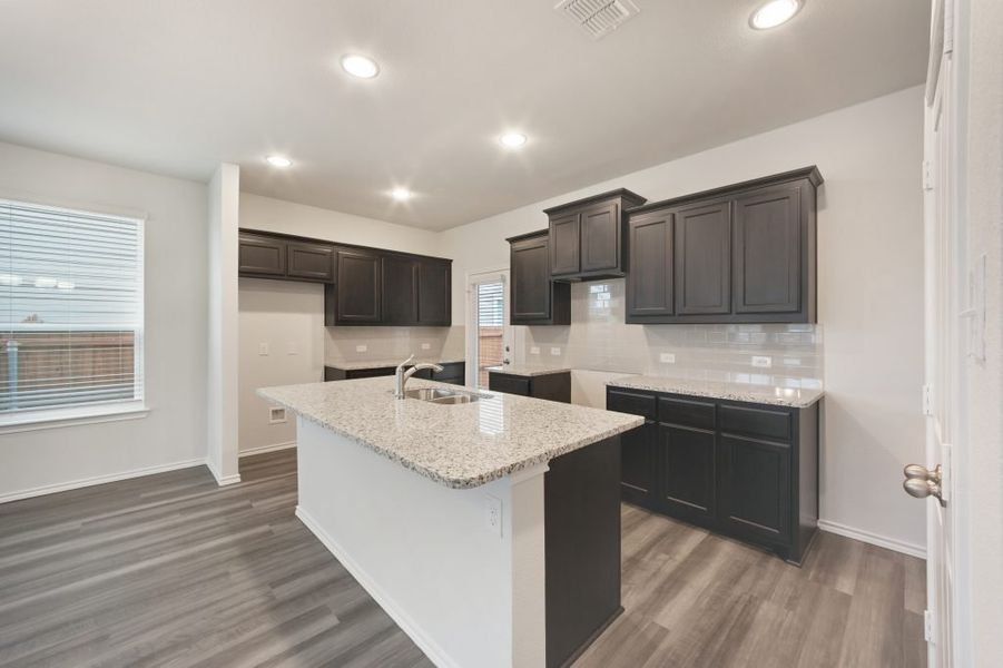 Representative exterior photo of a completed home built from the Harwood by Impression Homes in Heartland, Heartland, TX (Image 7).