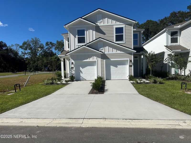 Front exterior of a new home in Irongate Villas, Jacksonville, FL, highlighting curb appeal (Image 25). Front exterior of a new home in Irongate Villas, Jacksonville, FL, highlighting curb appeal (Image 25).
