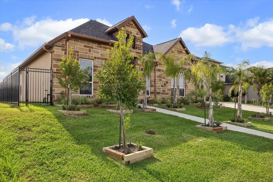 Front exterior of a new home in , Kemah, TX, highlighting curb appeal (Image 24). Front exterior of a new home in , Kemah, TX, highlighting curb appeal (Image 24).