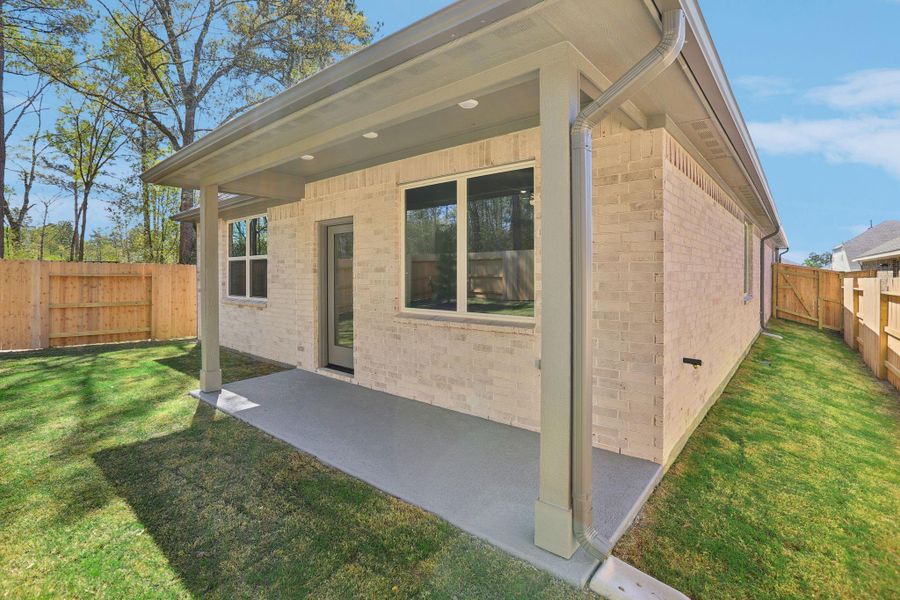 Exterior details and patio area of a home in Woodhavyn 40', Magnolia (Image 21).