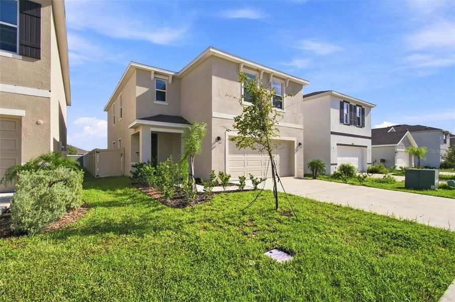 Front exterior of a new home in , Wesley Chapel, FL, highlighting curb appeal (Image 25).