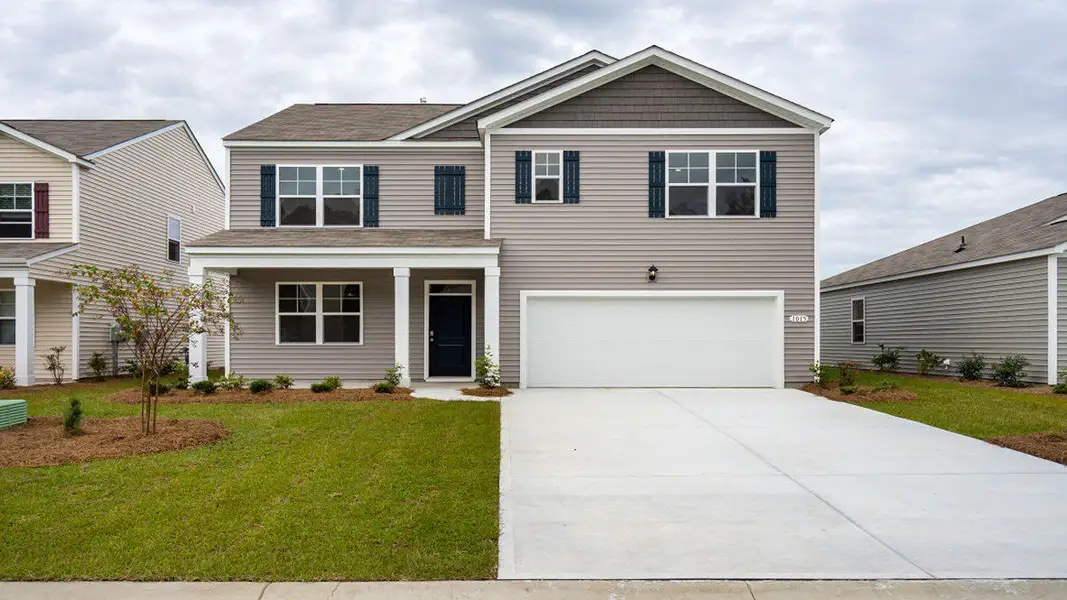 Front exterior of a new home in Cypress Landing, Hardeeville, SC, highlighting curb appeal (Image 1). Front exterior of a new home in Cypress Landing, Hardeeville, SC, highlighting curb appeal (Image 1).