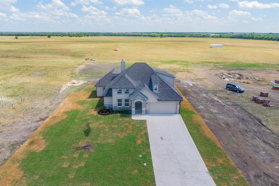 Birds eye view of property with a rural view